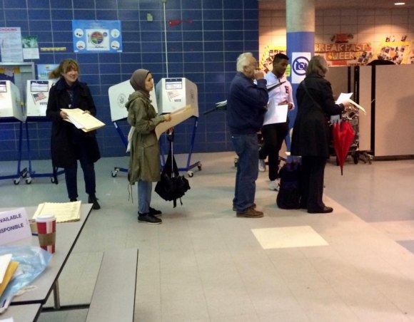 Roosevelt Islanders Behind the Vote, Making It Happen Higher than usual midterm voting required managing orderly lines at voting machines.
